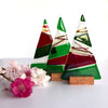 A Fiery Heart | Table-top Christmas tree in wooden stand |